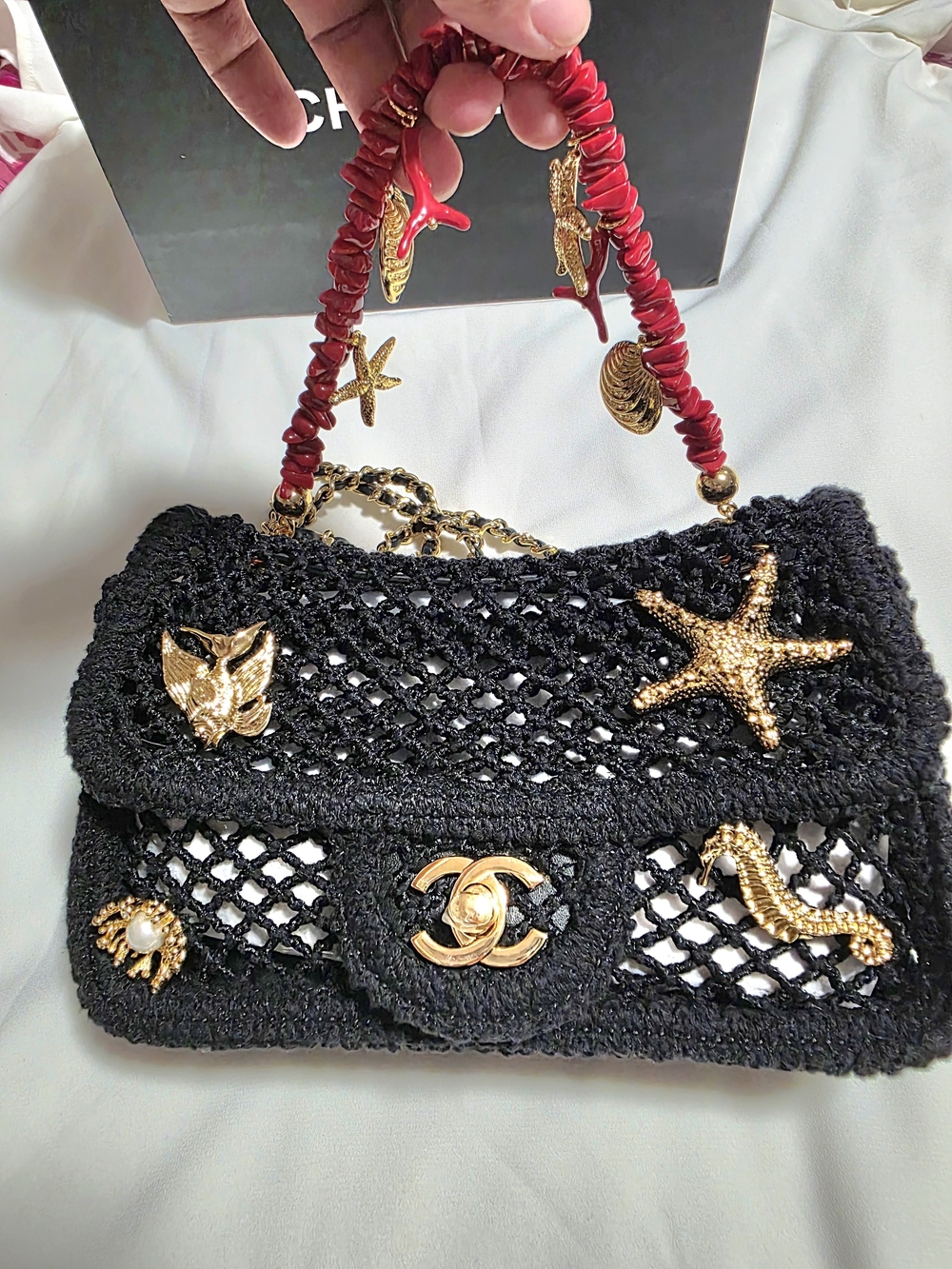 CHANEL Black Crochet Satchel with Gold Sea Charms and Red Handle